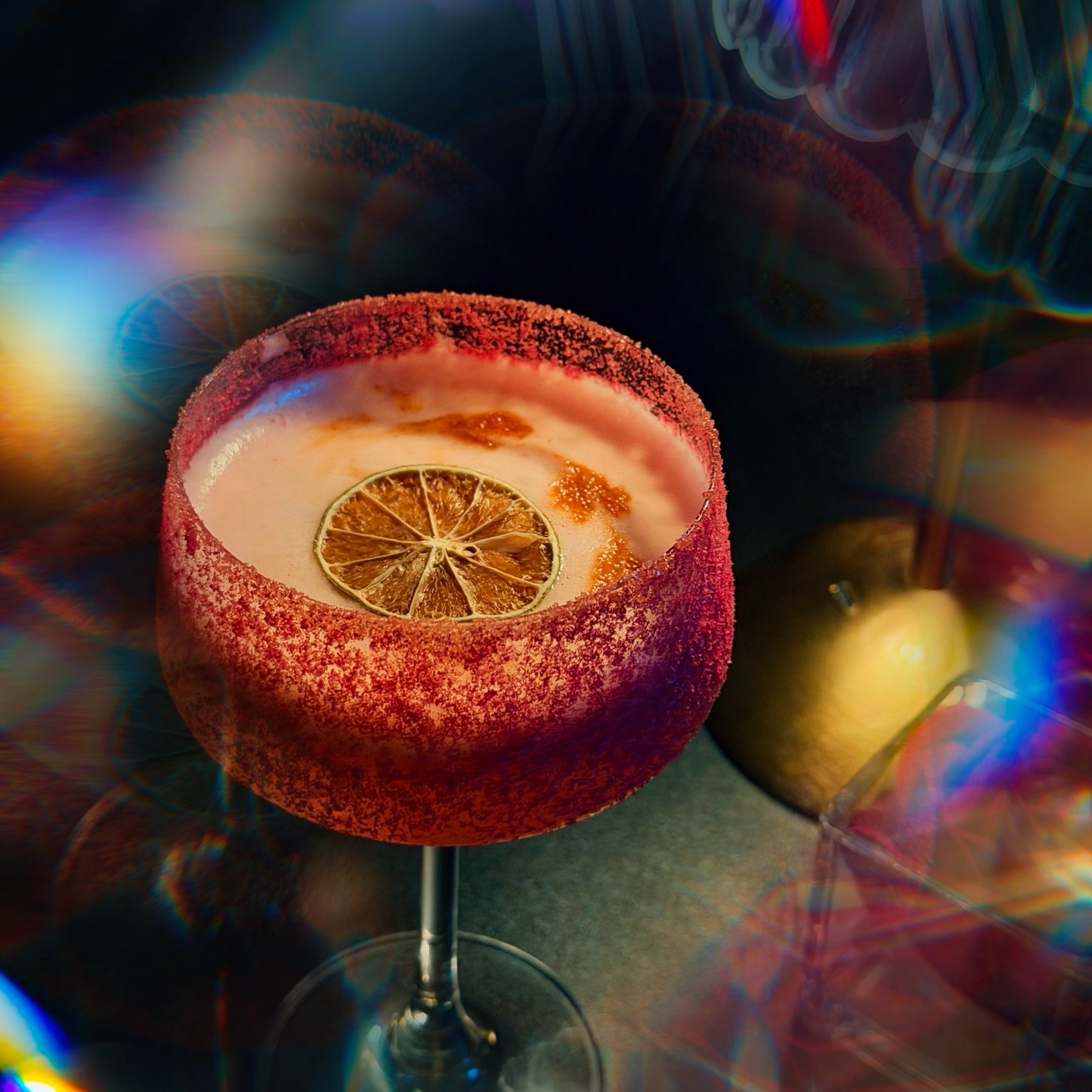 Signature cocktail with prismatic light